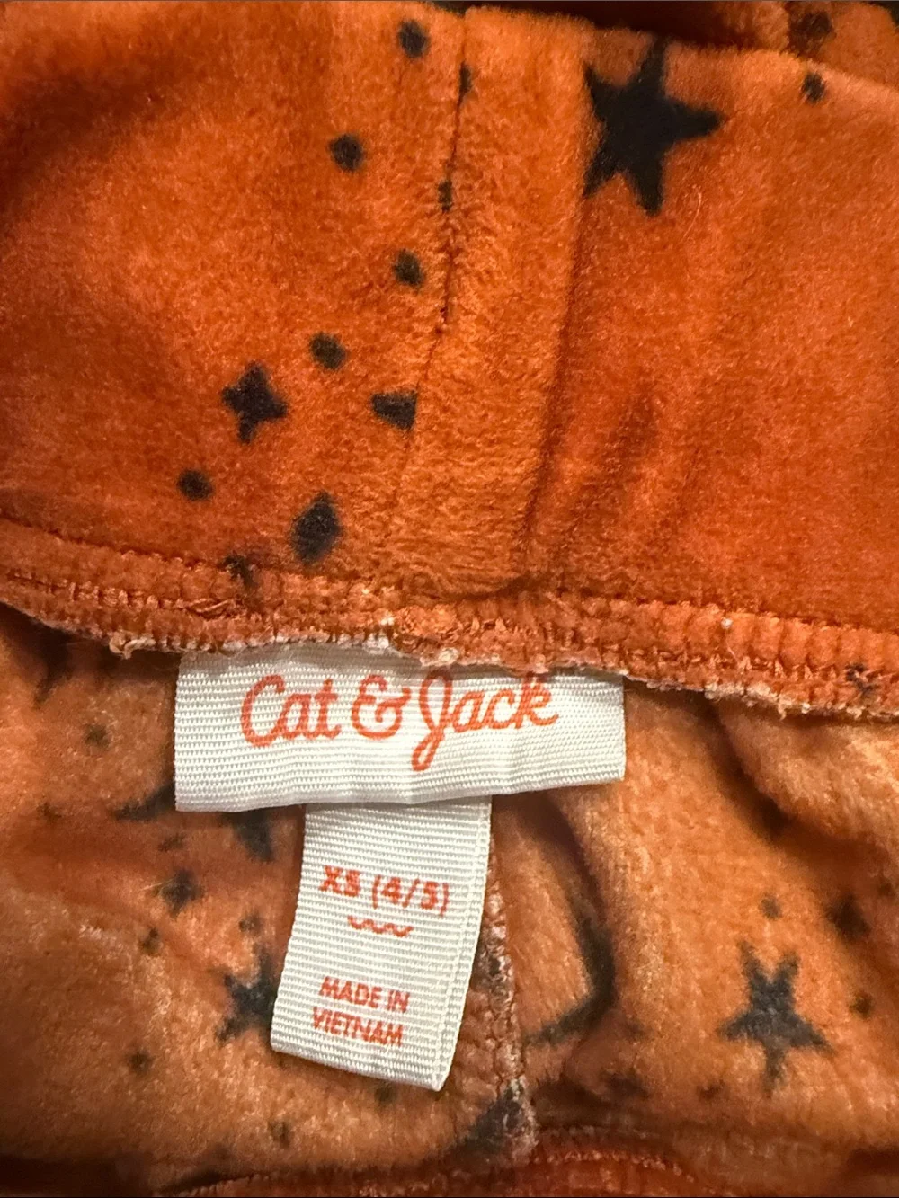 Cat & Jack rust orange velour set with black star pattern size xsmall.